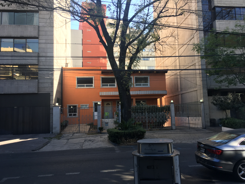 A house that hasn’t succumbed to urbanization, and a grey audi
